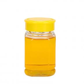 Empty glass hexagon jar with lid for honey